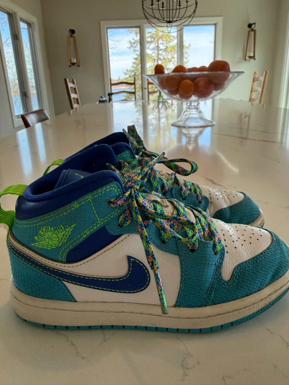 Nike Air Jordan Kids' Blue and White High-Top Sneakers.
